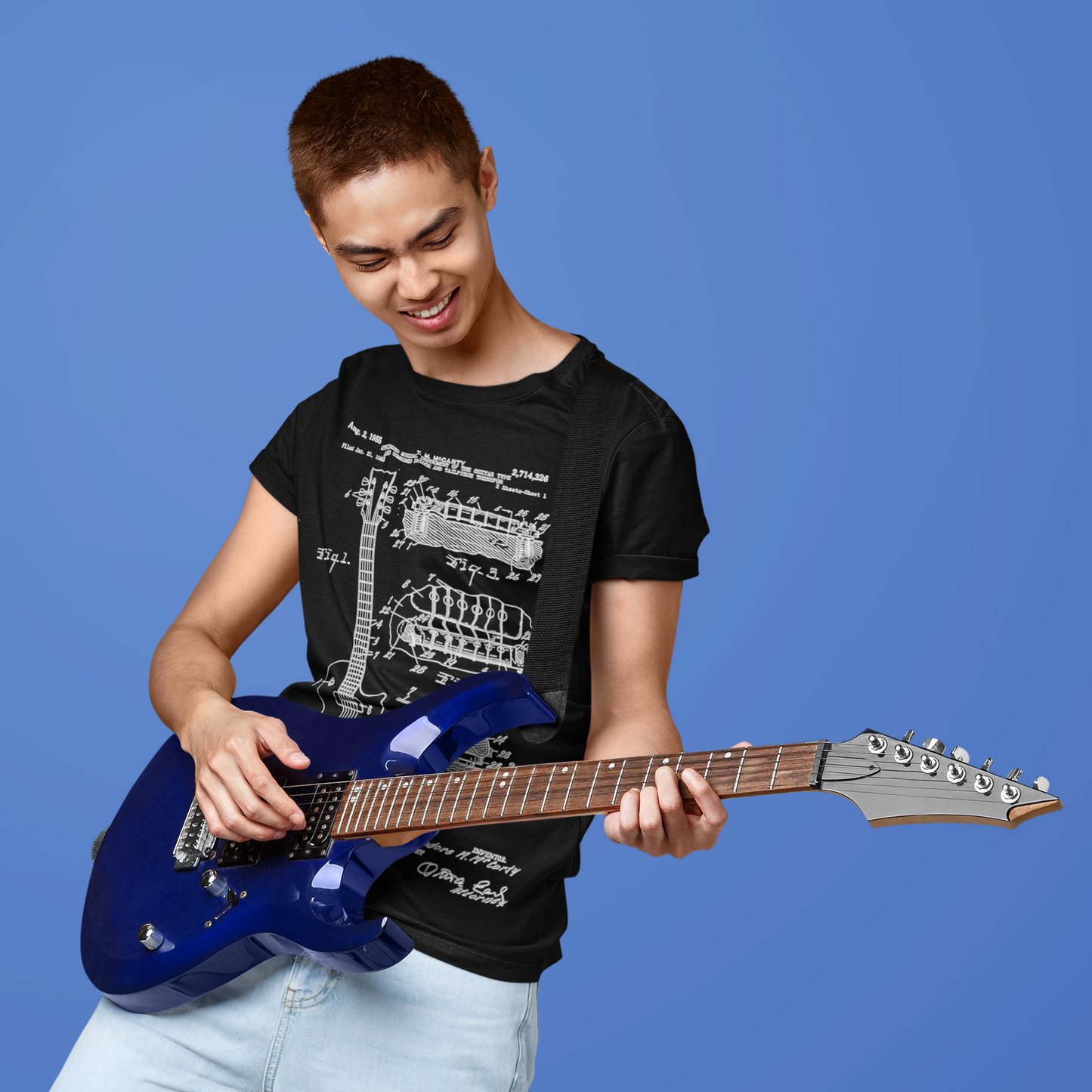 Guitar player wearing guitar blueprint t-shirt